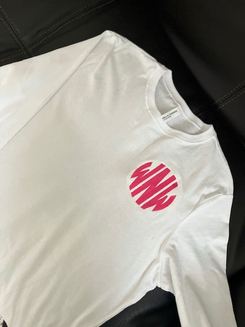 A white round-neck long sleeve t-shirt with a red embroidered monogram on the chest.
